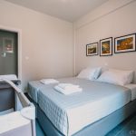 Spacious secondary bedroom with TV and view in the garden. A crib can be added upon request. Charys Premium Home
