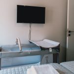 Spacious secondary bedroom with TV and view in the garden. A crib can be added upon request. Charys Premium Home