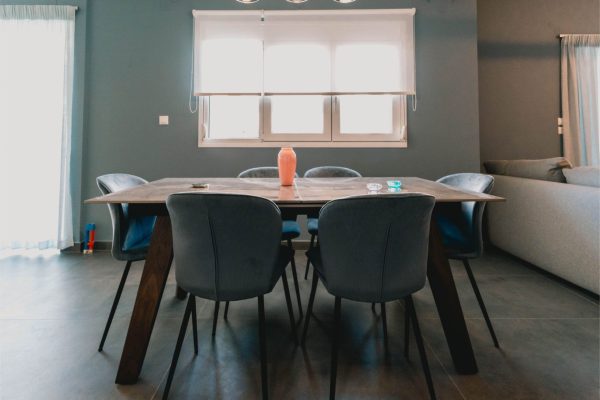 Spacious dining area with seating for up to 6 people and a dedicated high chair for babies. Charys Premium Home