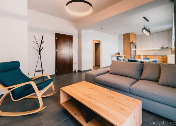 Luxury Vacation Home in Preveza, Greece with large smart TV, dedicated work desk, and comfortable seating area. Charys Premium Home.